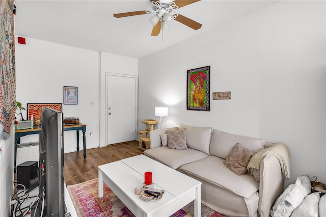 living room featuring ceiling fan and hardwood / wood-style flooring