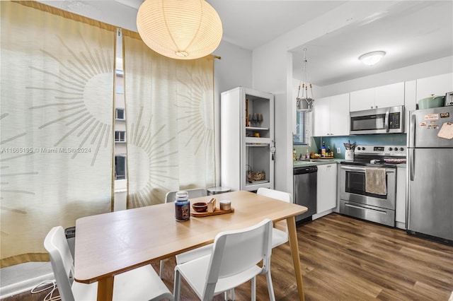 dining room featuring dark wood-type flooring