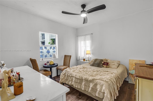 bedroom featuring dark hardwood / wood-style flooring and ceiling fan