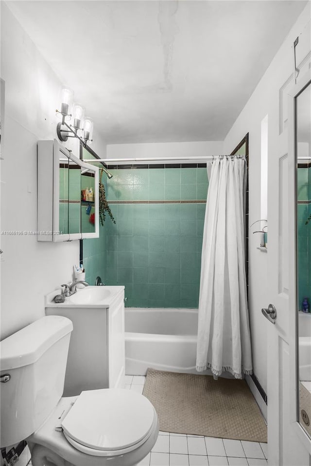 full bathroom featuring vanity, toilet, shower / bath combo with shower curtain, a notable chandelier, and tile patterned flooring