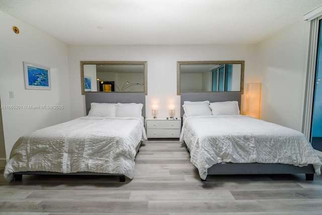 bedroom featuring wood-type flooring