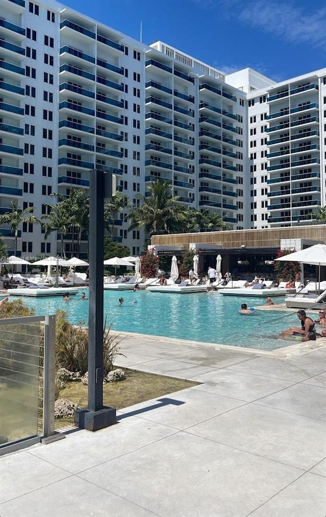 view of swimming pool featuring a patio area