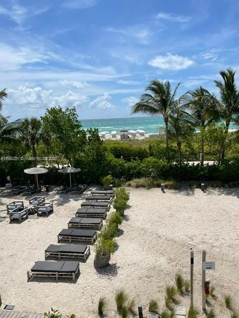 view of property's community featuring a view of the beach and a water view