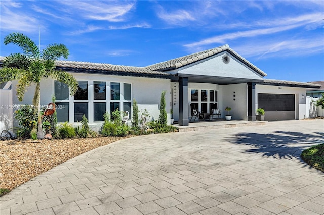 ranch-style house featuring a garage