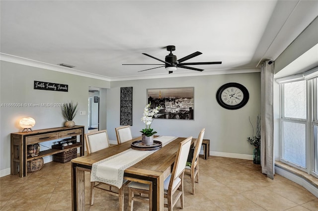 dining space featuring crown molding, light tile patterned floors, and ceiling fan