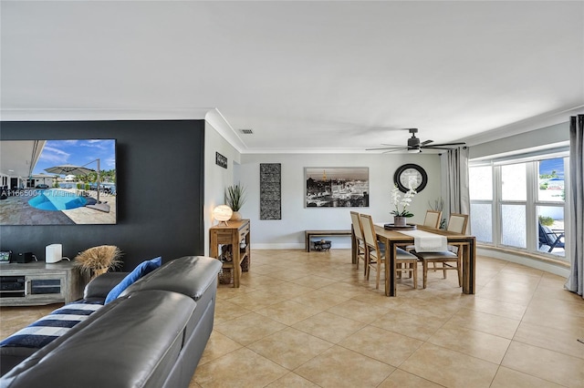 dining area with ceiling fan, light tile patterned floors, and ornamental molding