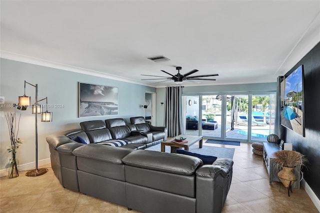 living room with ornamental molding, ceiling fan, and light tile patterned floors