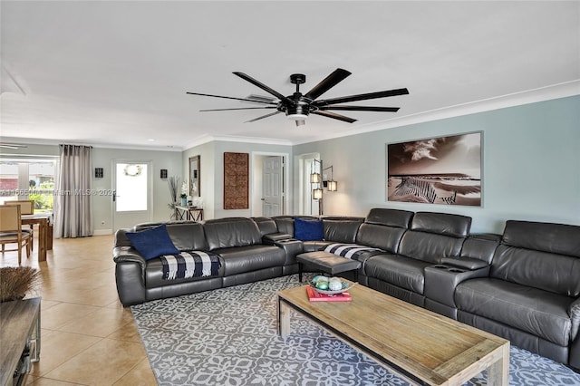 tiled living room featuring ornamental molding and ceiling fan