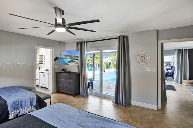 bedroom with light tile patterned flooring, ensuite bath, ceiling fan, and access to exterior