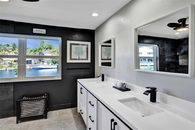 bathroom featuring ceiling fan, vanity, and tile patterned floors