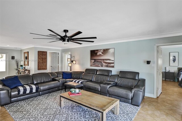 tiled living room featuring ornamental molding and ceiling fan