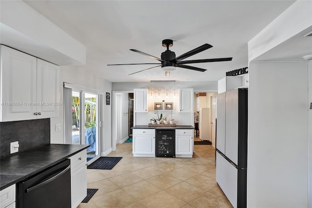 kitchen featuring white cabinets, white refrigerator, beverage cooler, ceiling fan, and stainless steel dishwasher