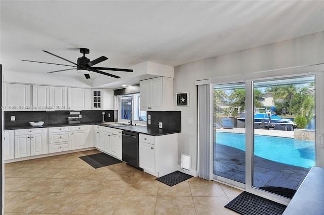 kitchen featuring white cabinetry, tasteful backsplash, dishwasher, ceiling fan, and sink