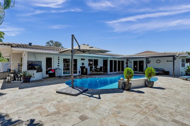 view of swimming pool featuring a patio area