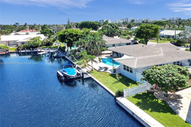 birds eye view of property with a water view