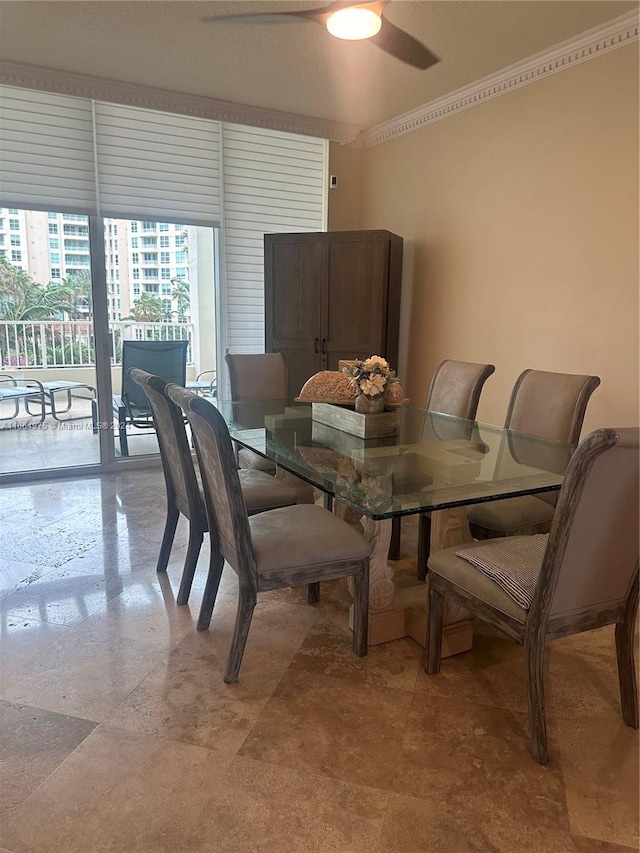 dining area with a textured ceiling and ceiling fan