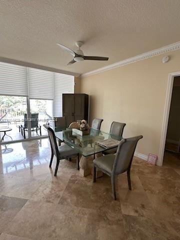 dining space featuring ceiling fan, crown molding, and a textured ceiling