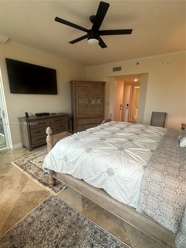 bedroom with ceiling fan, crown molding, and a textured ceiling