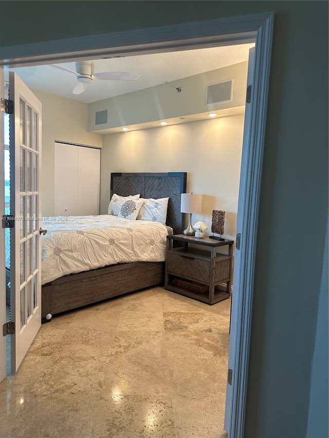 bedroom featuring a textured ceiling, a closet, and ceiling fan