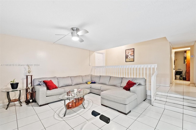 living room featuring light tile patterned floors and ceiling fan