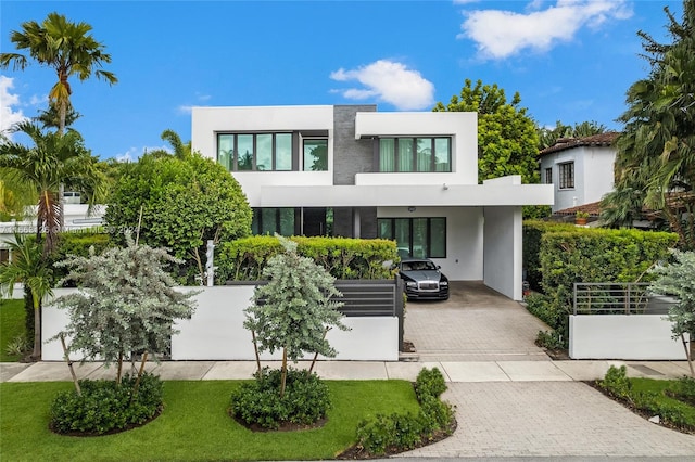 5327 N Bay Rd, Miami Beach, FL 33140 - modern home with stucco siding and decorative driveway
