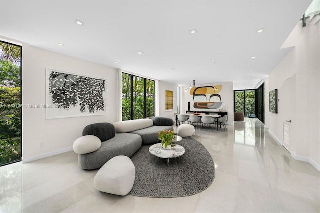 tiled living room featuring expansive windows and a healthy amount of sunlight