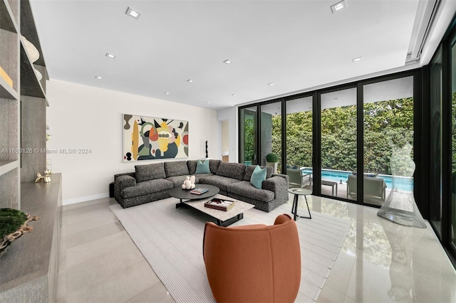 5327 N Bay Rd, Miami Beach, FL 33140 - tiled living area with expansive windows, baseboards, and recessed lighting