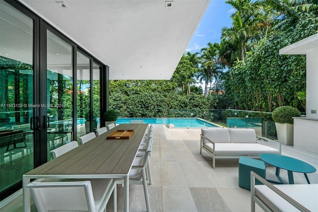 5327 N Bay Rd, Miami Beach, FL 33140 - view of swimming pool with a patio, an outdoor hangout area, french doors, and outdoor dining space