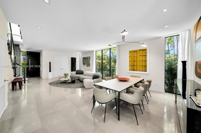 5327 N Bay Rd, Miami Beach, FL 33140 - dining area featuring plenty of natural light, baseboards, expansive windows, and recessed lighting