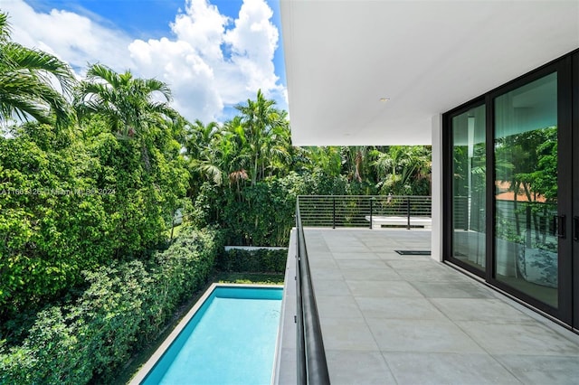 5327 N Bay Rd, Miami Beach, FL 33140 - view of pool featuring view of scattered trees