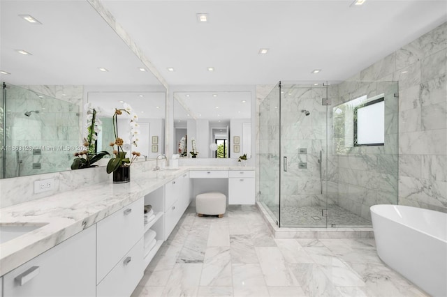 5327 N Bay Rd, Miami Beach, FL 33140 - bathroom with a marble finish shower, a freestanding bath, double vanity, marble finish floors, and recessed lighting