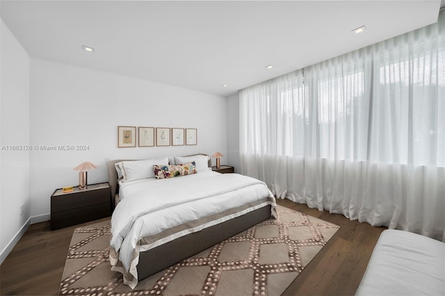 5327 N Bay Rd, Miami Beach, FL 33140 - bedroom featuring wood finished floors, multiple windows, and baseboards