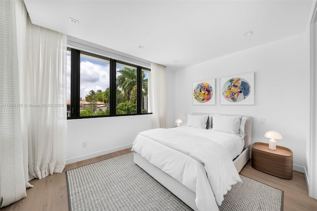 5327 N Bay Rd, Miami Beach, FL 33140 - bedroom featuring baseboards and wood finished floors