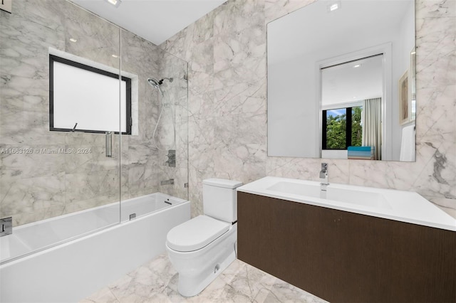 5327 N Bay Rd, Miami Beach, FL 33140 - bathroom with toilet, tile walls, tub / shower combination, marble tiled floors, and vanity