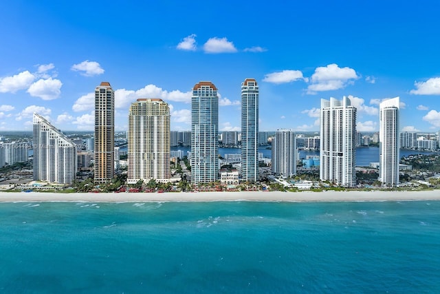 exterior space with a beach view and a water view