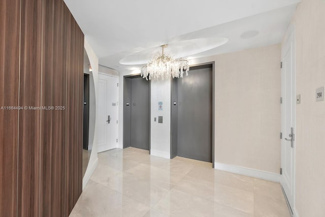 interior space with elevator and a notable chandelier