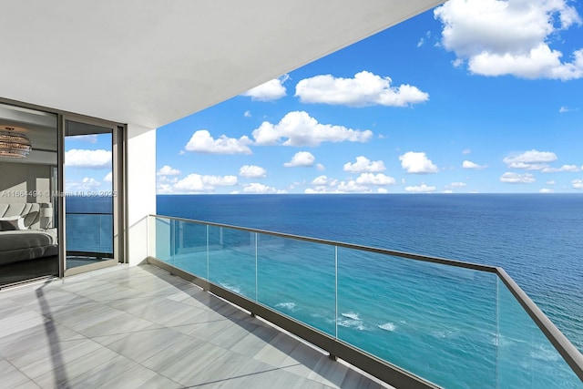 balcony featuring a water view