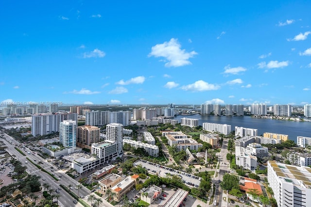 drone / aerial view featuring a view of city and a water view