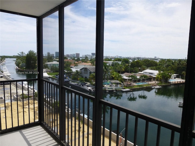 balcony featuring a water view