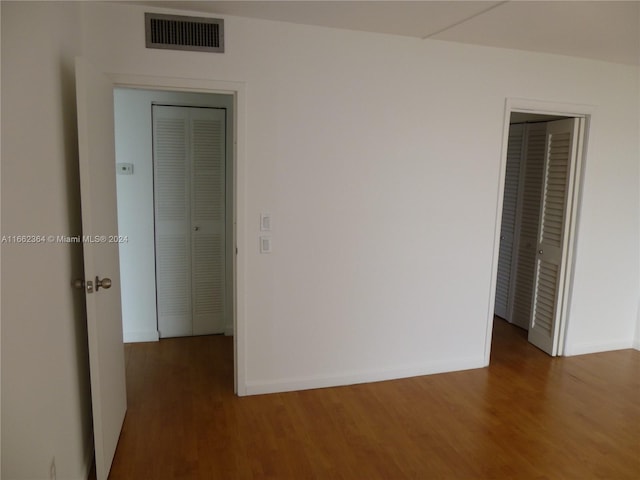 empty room featuring dark hardwood / wood-style floors