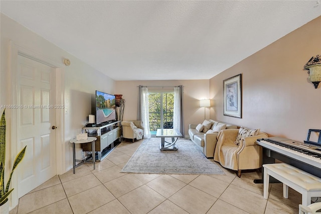 living room with light tile patterned floors and a textured ceiling