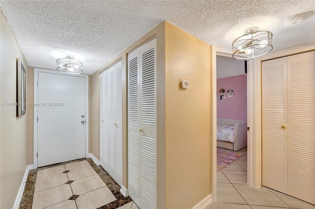 bedroom with a closet and light tile patterned floors