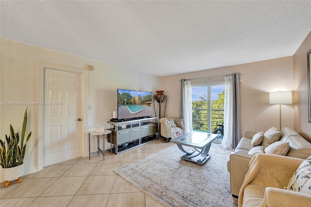 living room with light tile patterned floors and a textured ceiling