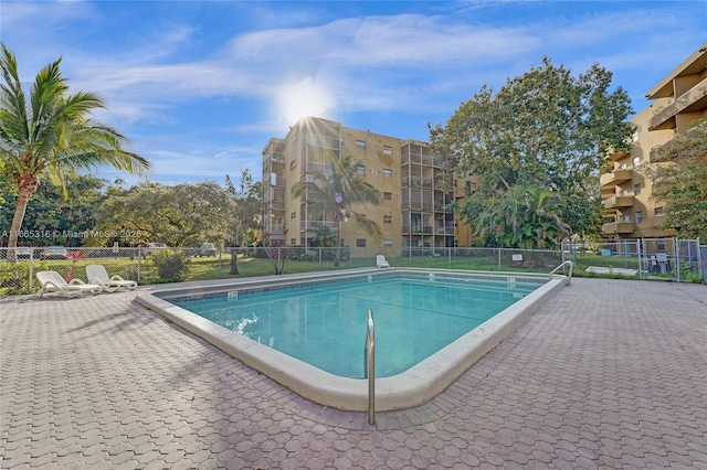 community pool featuring fence