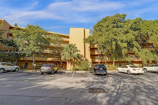 view of property with uncovered parking