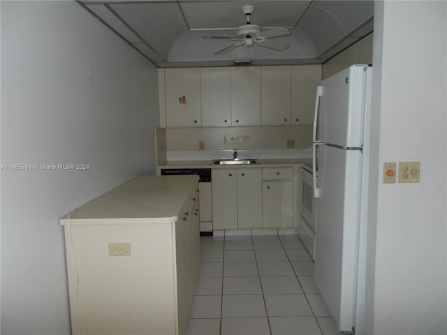 kitchen featuring ceiling fan, light tile patterned floors, sink, white appliances, and white cabinetry