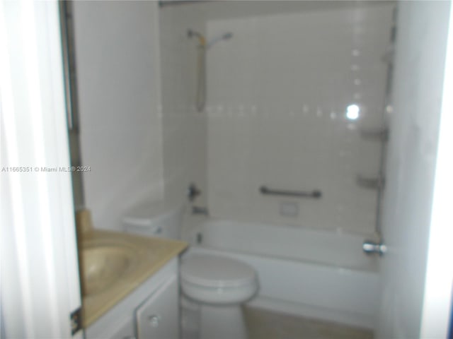 full bathroom with  shower combination, vanity, and toilet