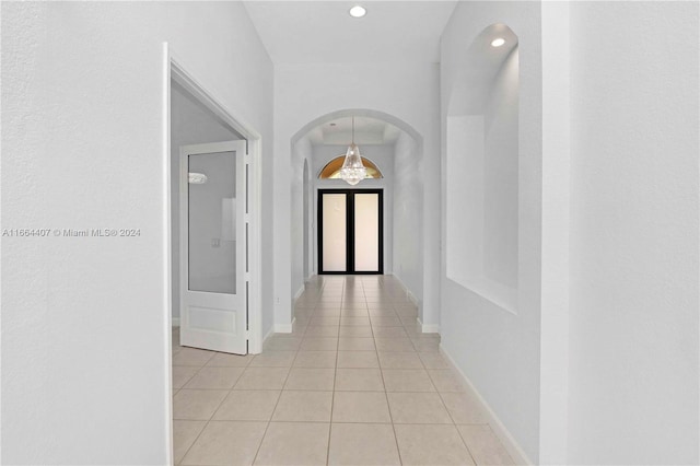 hallway featuring light tile patterned floors