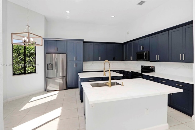 kitchen with black range with electric cooktop, light tile patterned flooring, stainless steel fridge, sink, and a kitchen island with sink