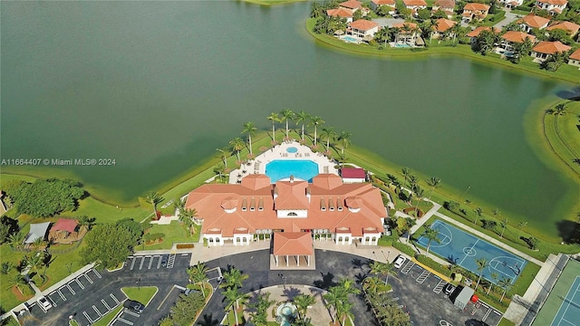 birds eye view of property with a water view